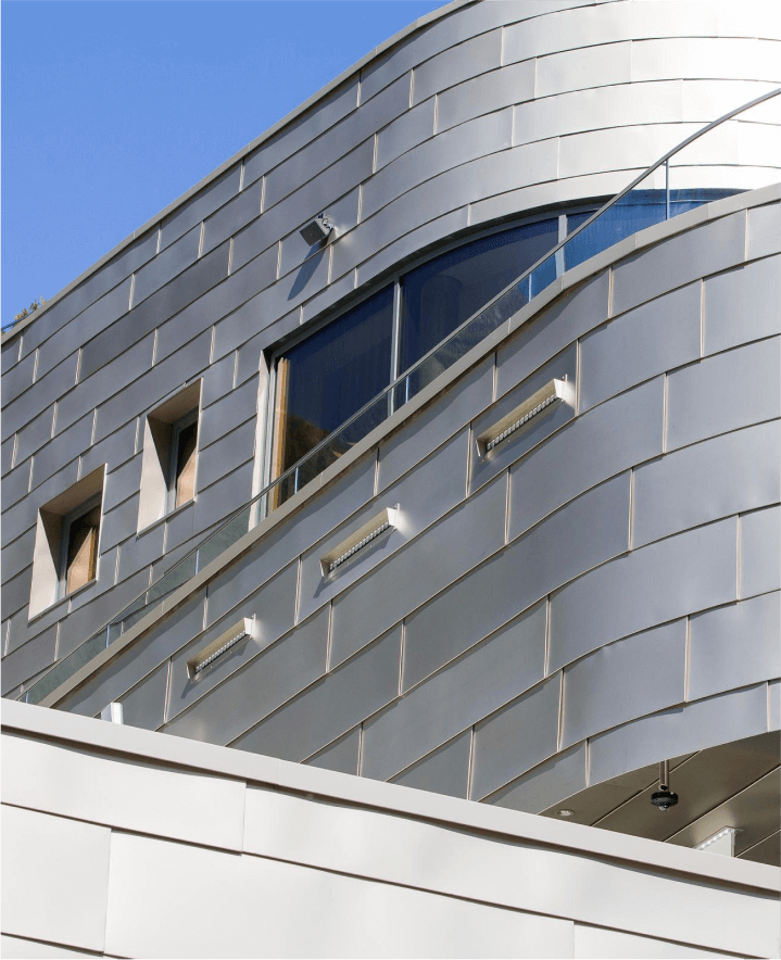 Flowing stainless steel facade of Silvretta Therme Spa in the Austrian Alps