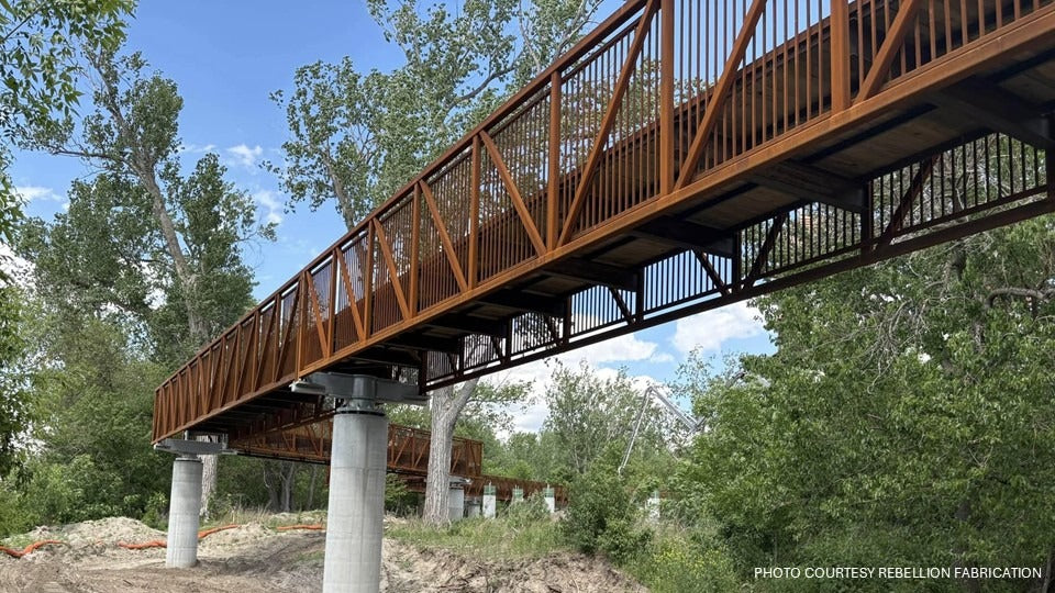 River’s Edge treetop walk leading to the steel observation tower above the landscape