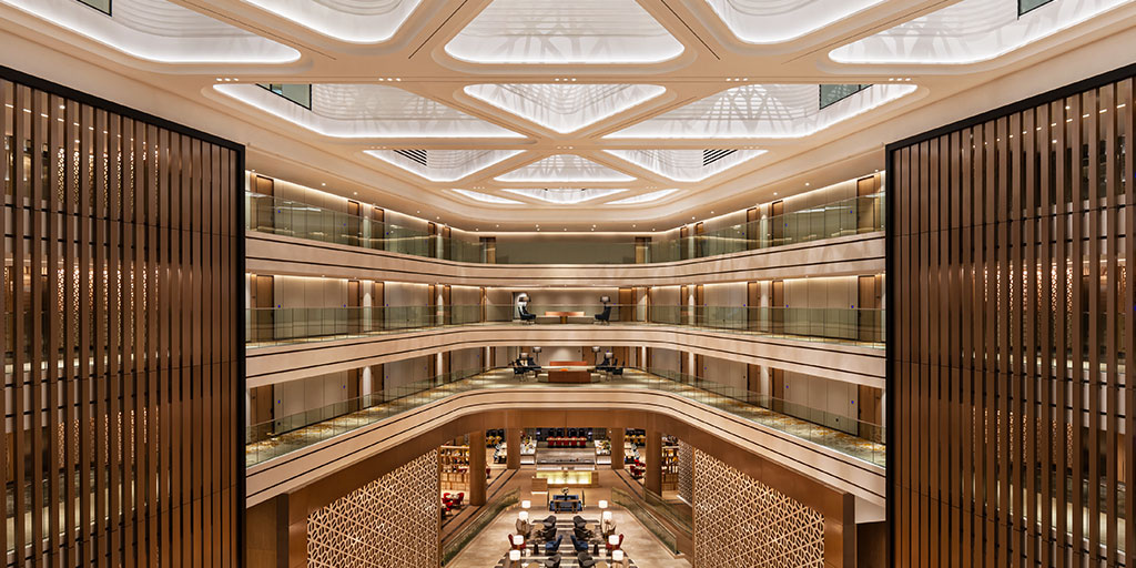 JA Lake View Hotel atrium with illuminated fretwork and mashrabiya details