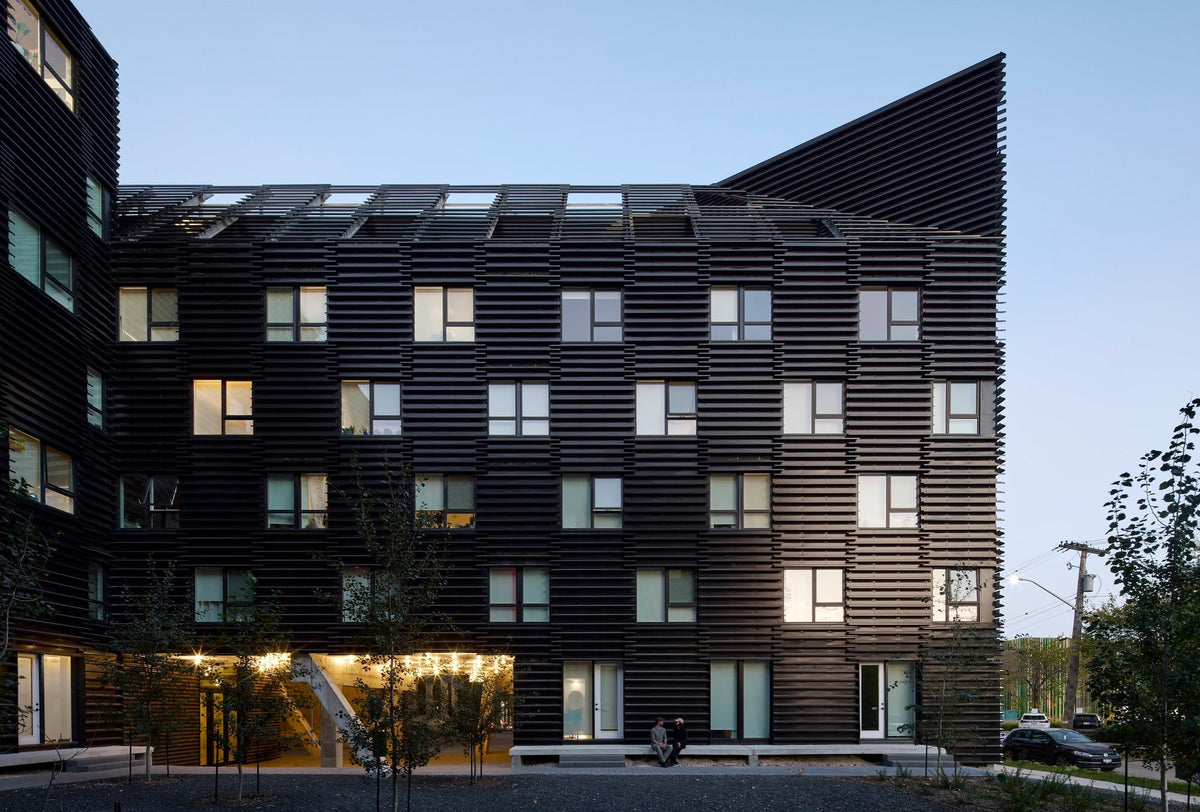 90/100 Mixed Use Project in Winnipeg with a textured modular sheet-metal facade