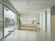 Hybrid Infrastructure Doble Erre in Madrid with reflective metal surfaces and a flexible cultural workspace