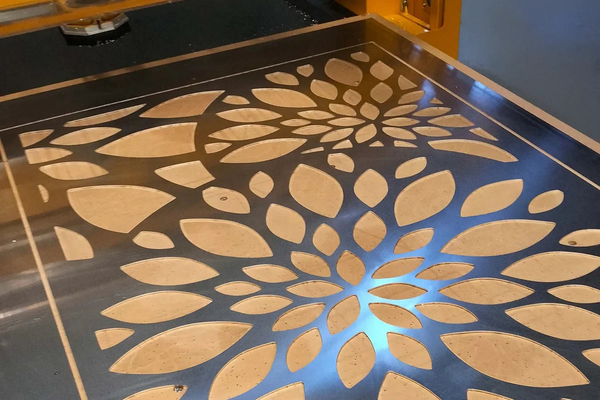 Patterned aluminium plate on a CNC router table; manufacturing reference