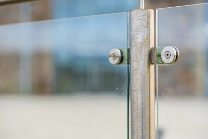 Stainless steel architectural surface with visible tea staining