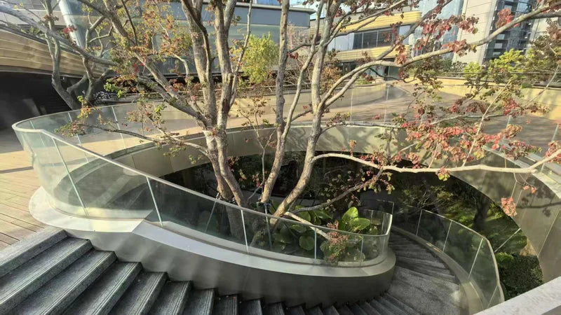 Curved stainless steel honeycomb panel cladding beside the garden staircase at Pazhou Yue, Guangzhou