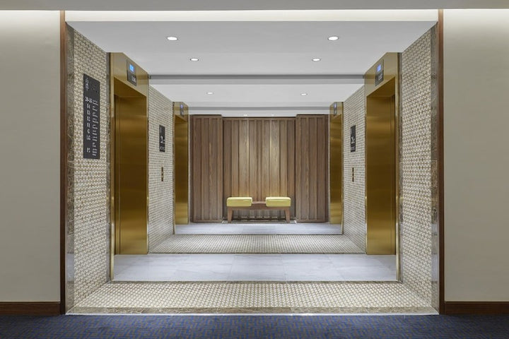 voco Makkah: Gold Elevator Surrounds and Custom Lobby Chandelier