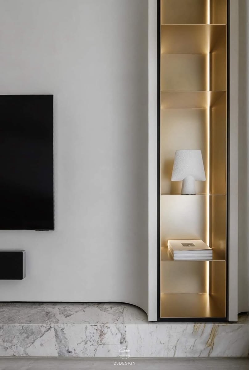 Custom stainless steel TV wall niche with integrated display shelving