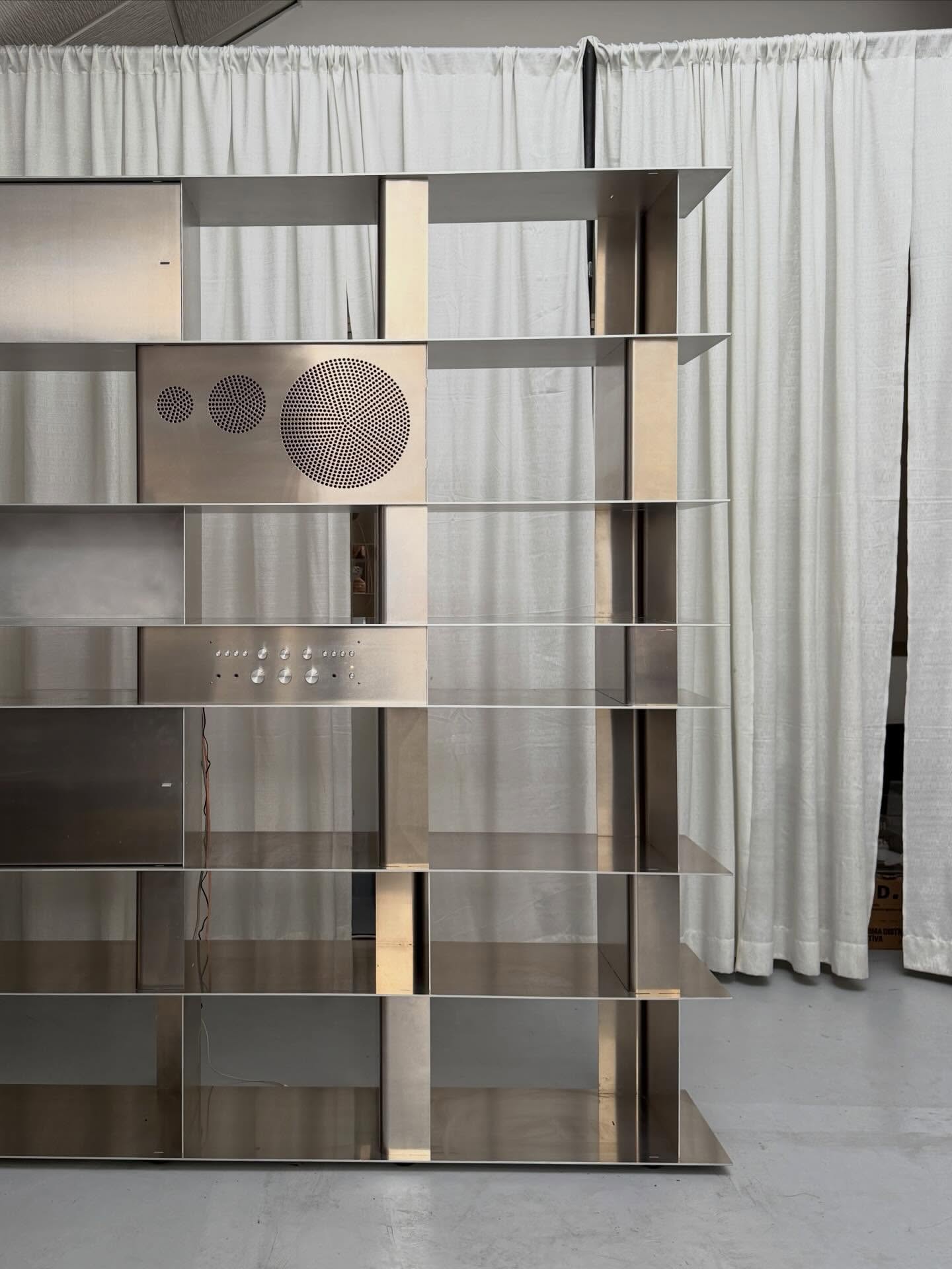 Custom freestanding stainless steel bookshelf with open display shelving