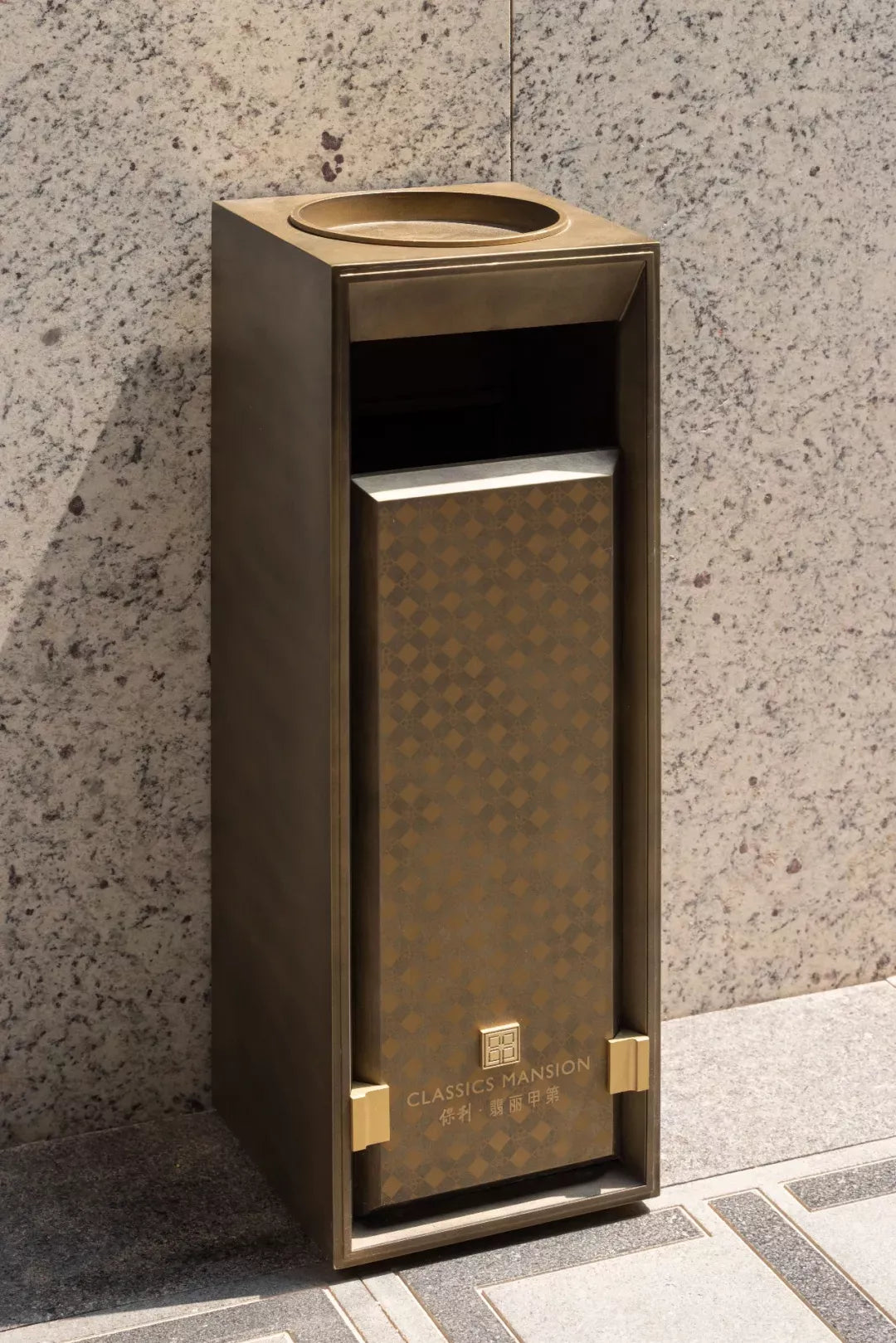 Architectural stainless steel hotel waste receptacle with bronze-toned finish