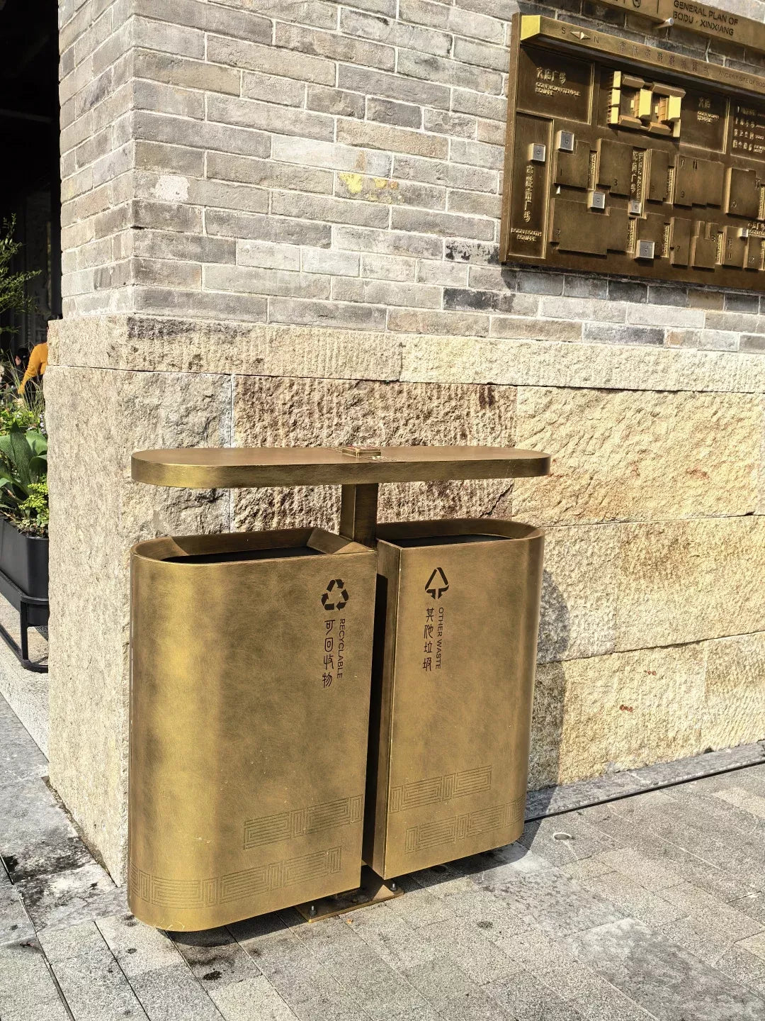 Ornamental brass-tone stainless steel hotel waste bin