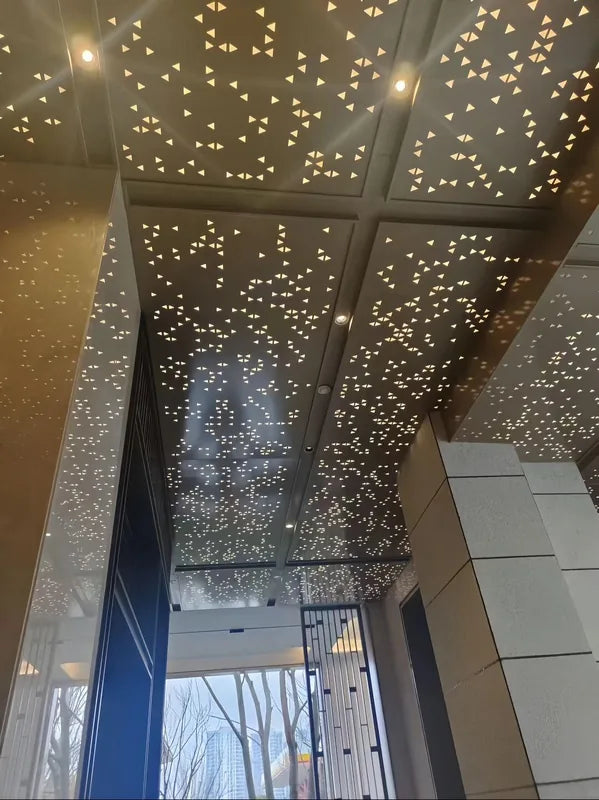 Aluminum corridor ceiling with scattered star-like triangular openings