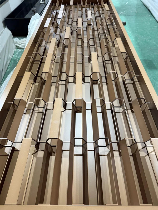 Angled panel view of bronze 3d faceted steel screen panel