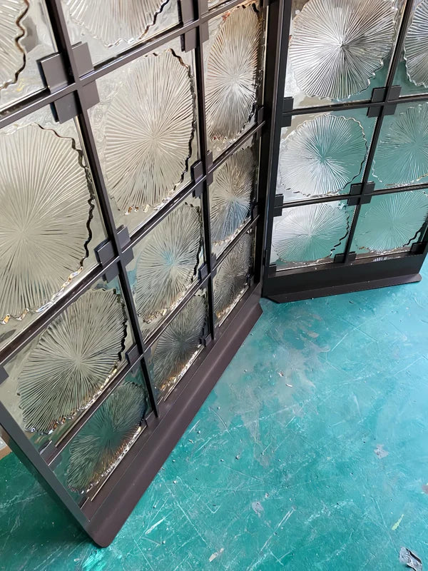 Angled screen view of bronze floral textured glass folding screen