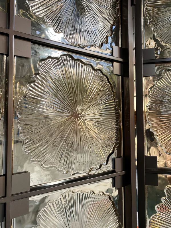Frame detail of bronze floral textured glass folding screen