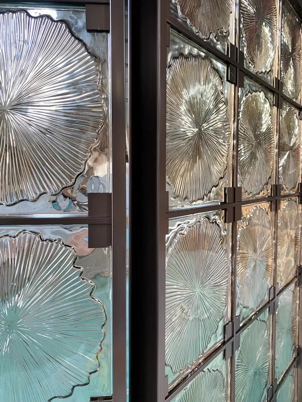 Assembly view of bronze floral textured glass folding screen