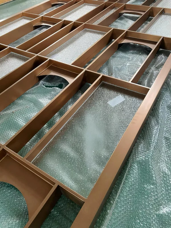 Angled screen view of bronze geometric framed stainless steel screen