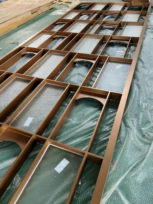 Frame detail of bronze geometric framed stainless steel screen