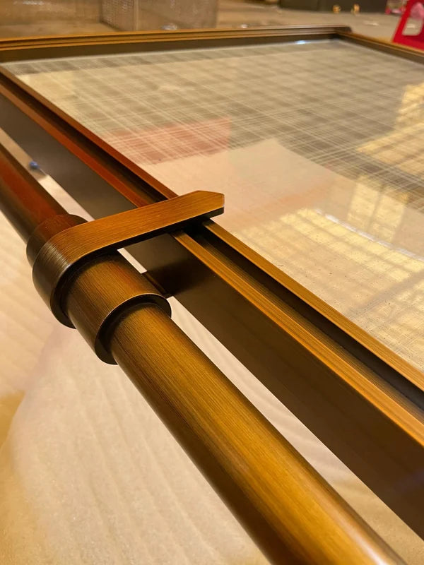 Pattern detail of bronze glass steel screen with tubular frame
