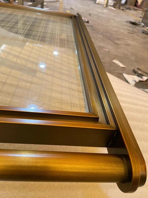 Frame and edge detail of bronze glass steel screen with tubular frame