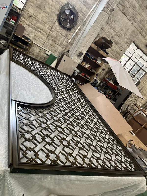 Angled panel view of bronze linear grille steel screen options
