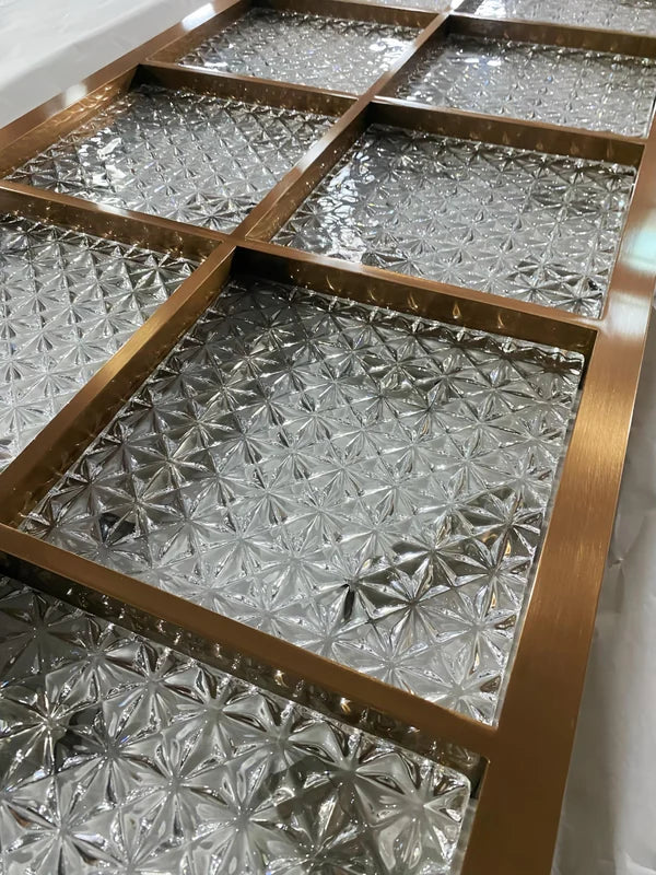 Overall workshop view of bronze star textured glass stainless steel screen panel