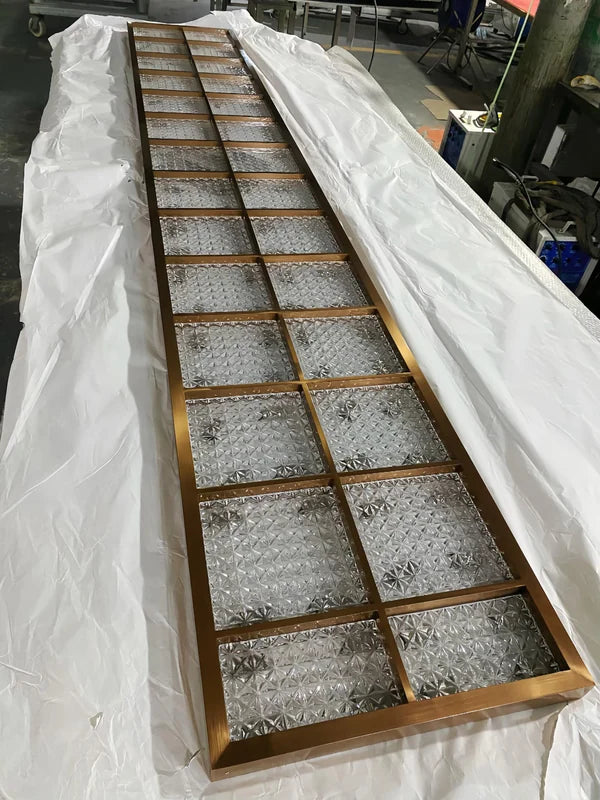 Angled screen view of bronze star textured glass stainless steel screen panel