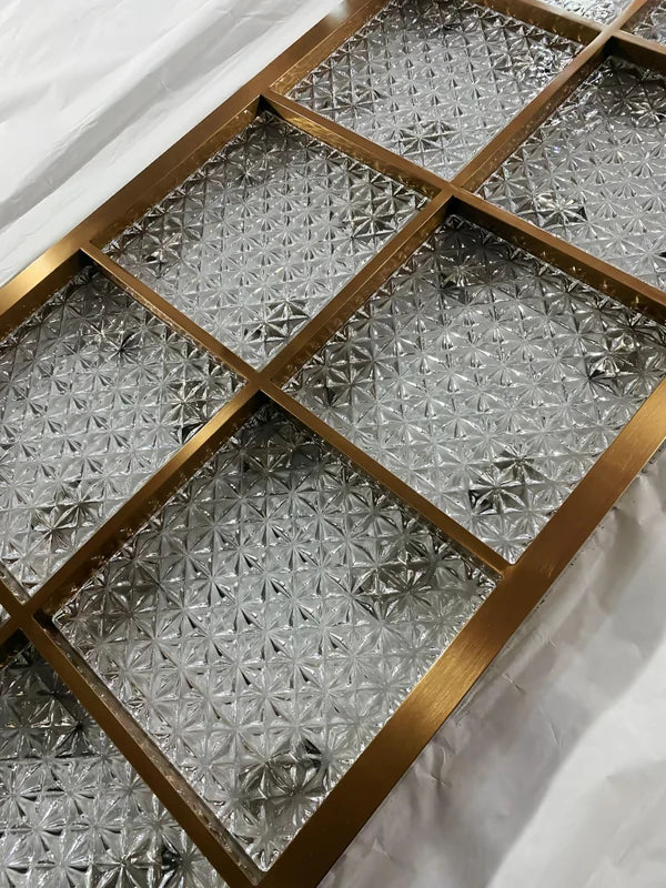 Frame detail of bronze star textured glass stainless steel screen panel