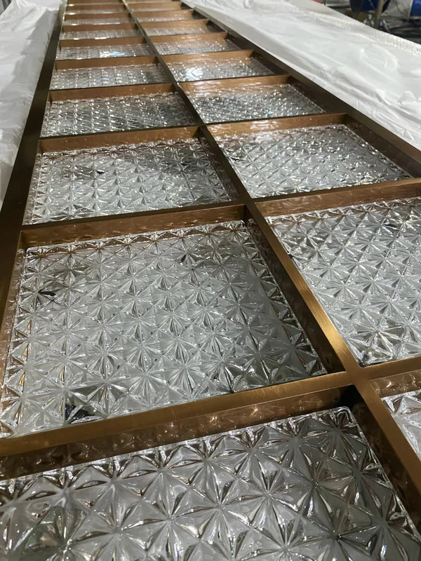 Infill detail of bronze star textured glass stainless steel screen panel