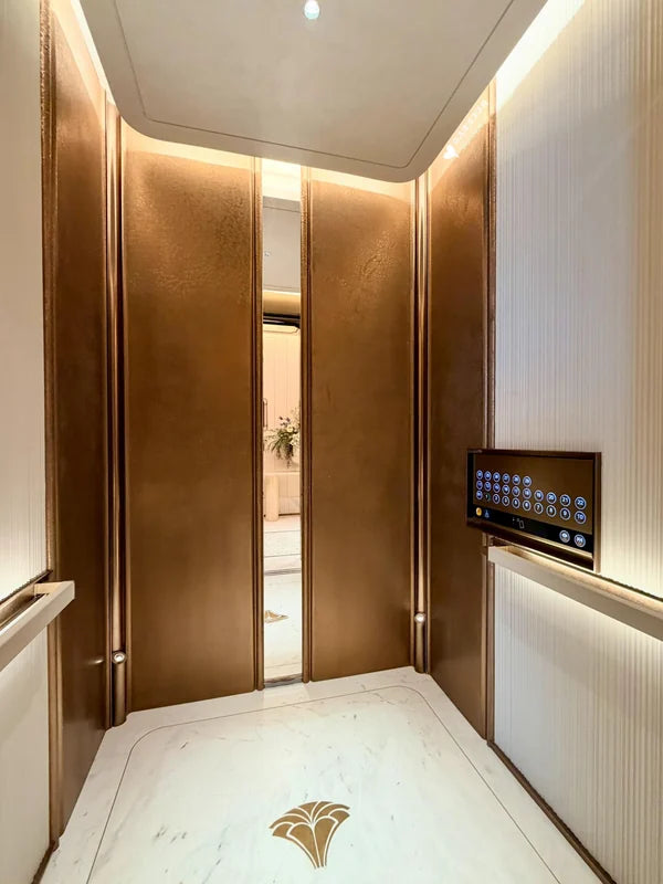 Champagne bronze elevator cabin wall and controls for custom Xinmao Metal elevator design