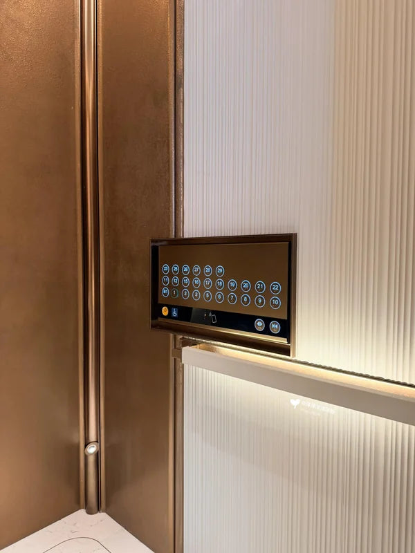 Control panel beside fluted cabin wall for custom Xinmao Metal elevator design