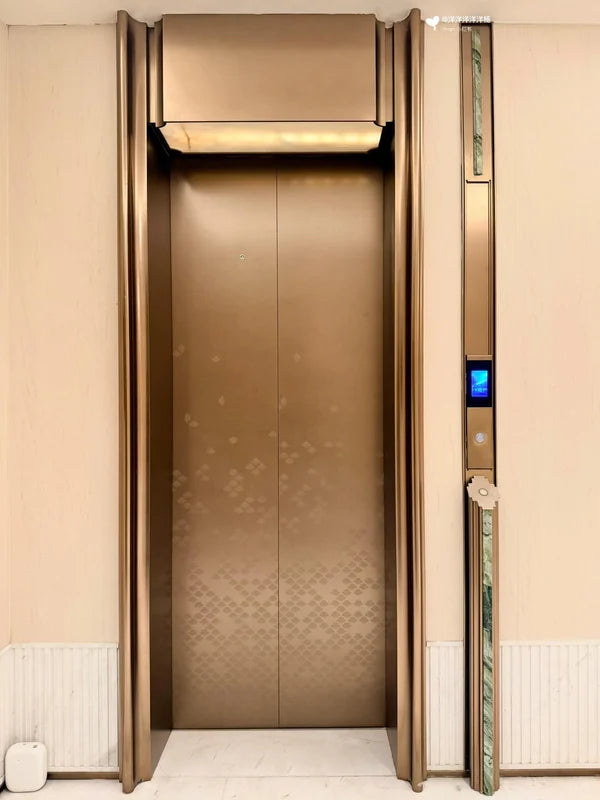 Champagne bronze elevator landing door with patterned lower panel for custom Xinmao Metal elevator design