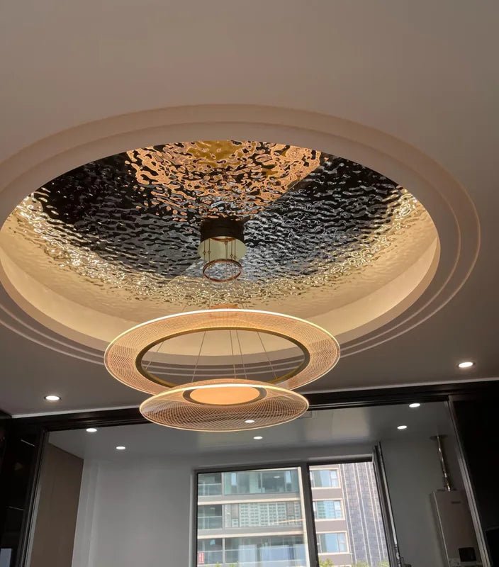 Circular water ripple ceiling insert with hanging ring lights