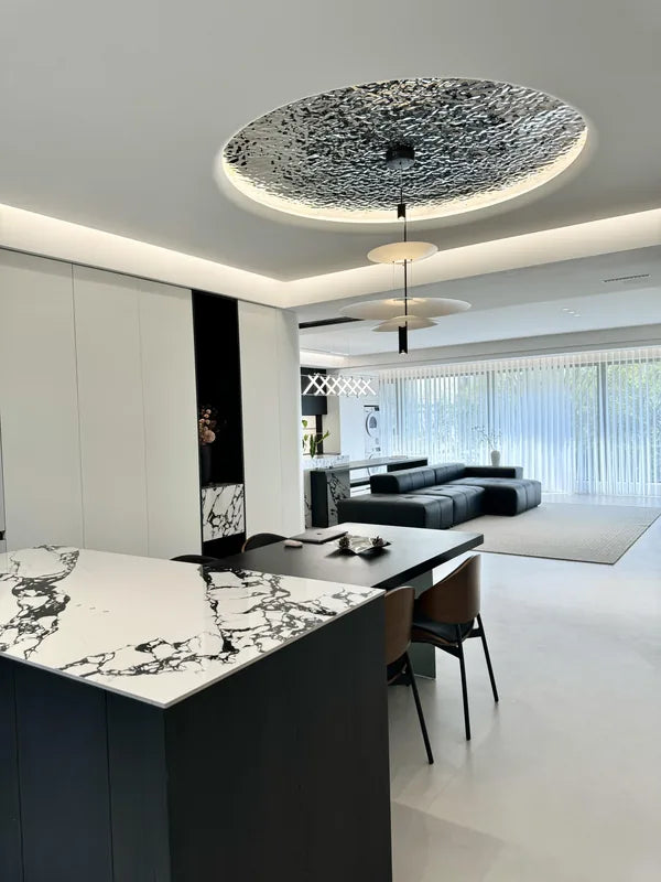 Circular water ripple ceiling seen from kitchen toward lounge