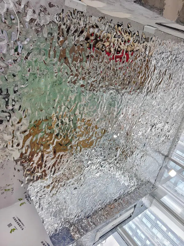 Close-up of bright ripple texture above kitchen area