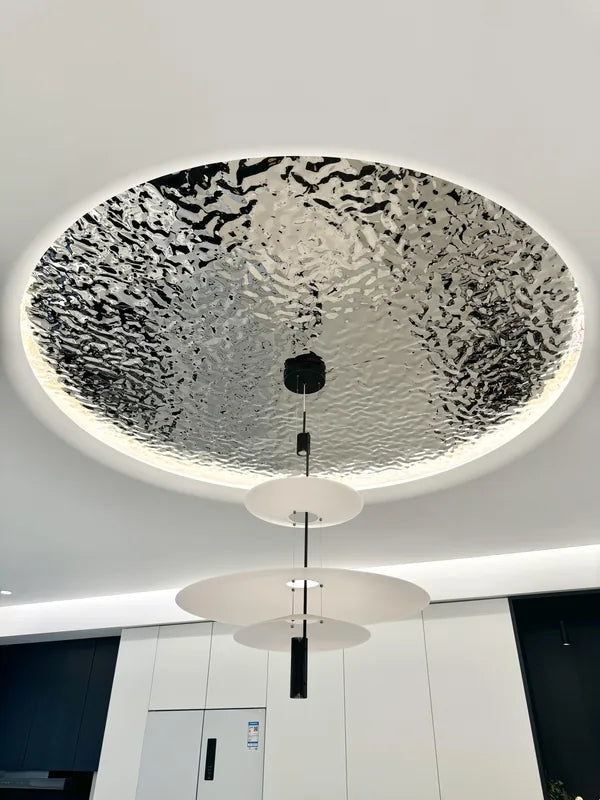 Close view of round ripple ceiling feature over dining table