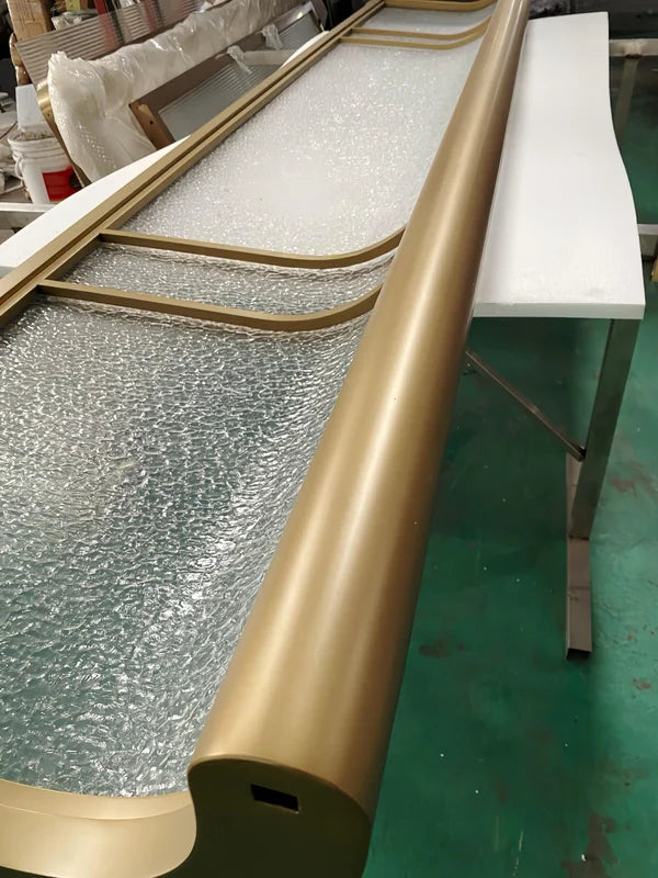 Infill detail of curved bronze textured glass stainless steel screen