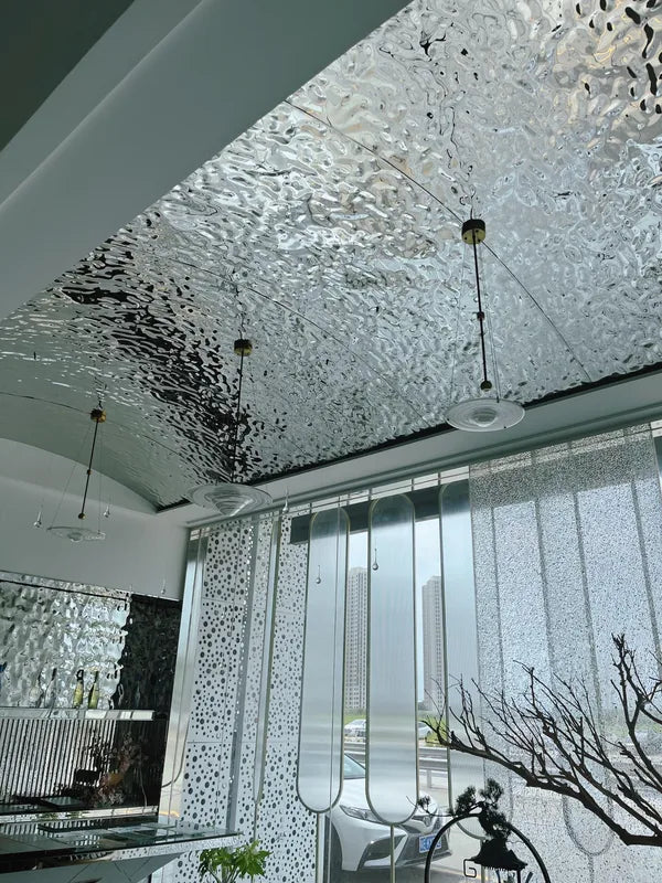 Curved water ripple ceiling with pendant drops over room