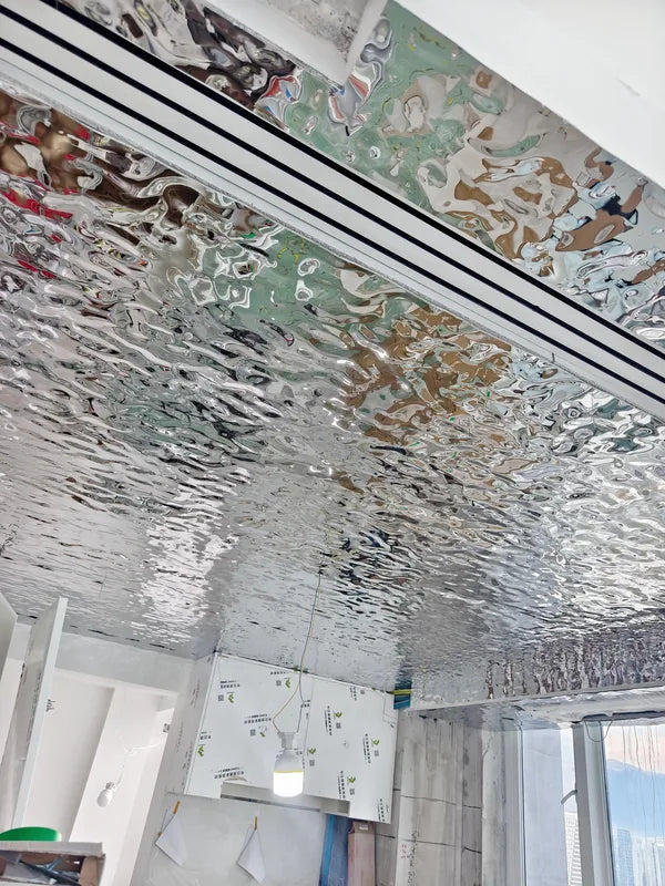 Detail of stainless water ripple ceiling and ventilation slot