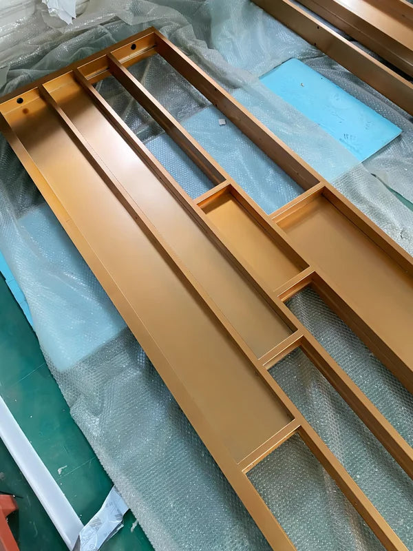 Angled screen view of gold linear architectural stainless steel screen frame