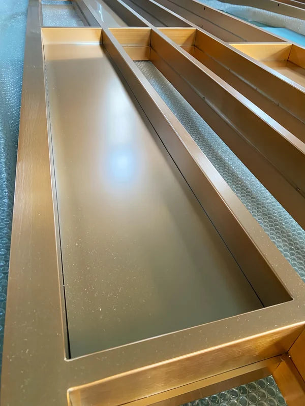 Infill detail of gold linear architectural stainless steel screen frame