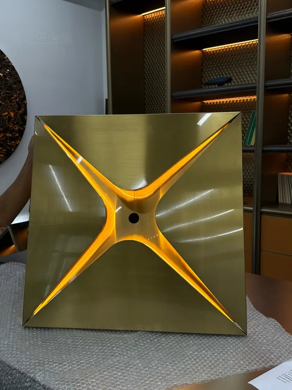 Gold sculpted star ceiling module sample with illuminated central aperture