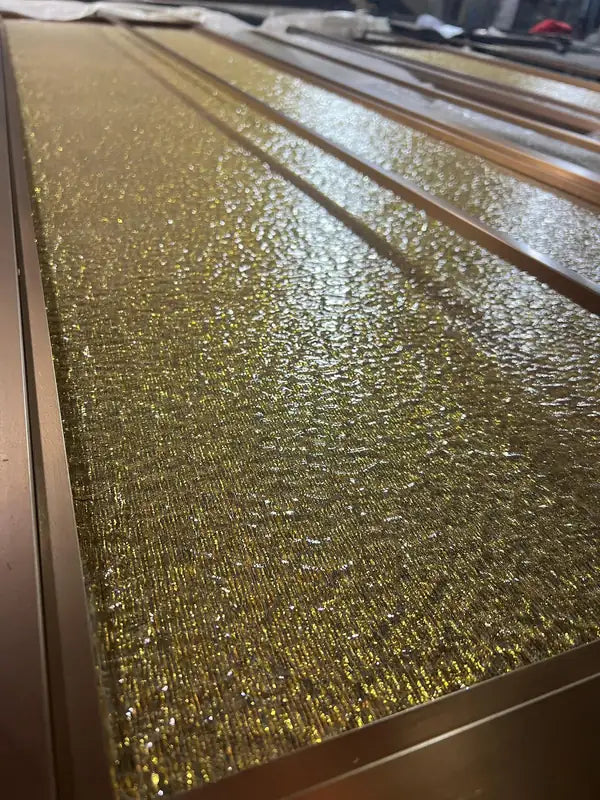 Close detail of Gold Textured Glass stainless steel Screen Panels