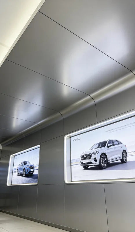 Grey anodized aluminum ceiling-to-wall curved corner detail