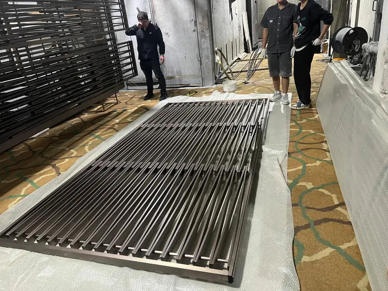Hotel lobby application of Black Vertical Slat stainless steel Screen With Art Panel