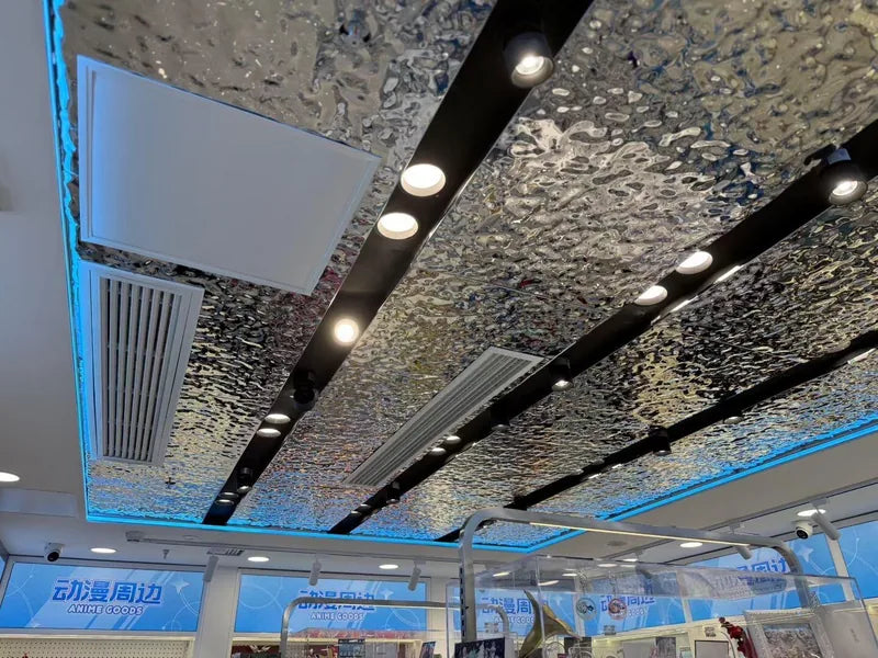 Linear water ripple ceiling with lights and air grilles, service reference