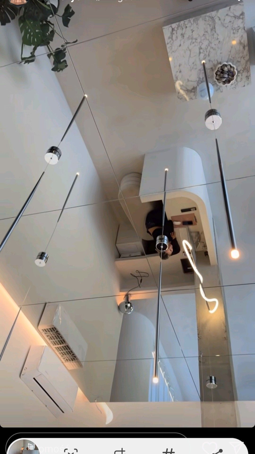 Close view of reflective ceiling with linear lighting, outlets and access features