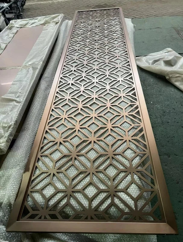 Overall workshop view of mixed geometric laser cut steel screen panels