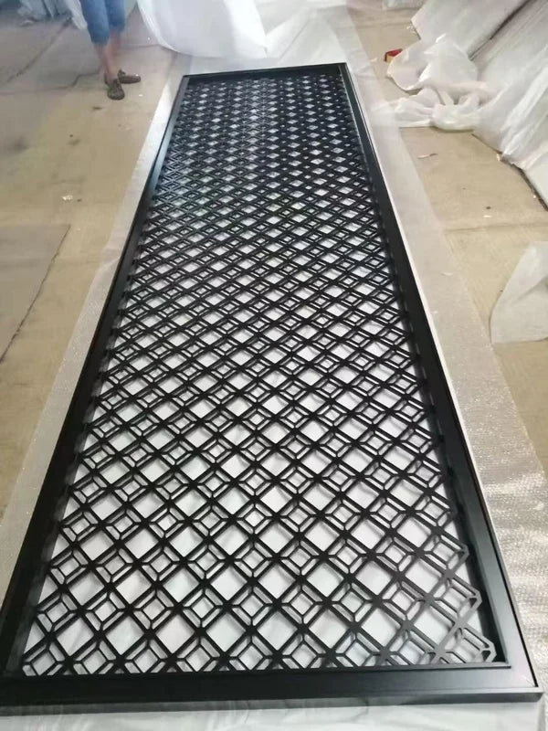 Frame and edge detail of mixed geometric laser cut steel screen panels
