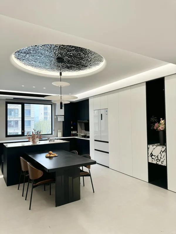 Open kitchen with circular ripple ceiling inset and pendant