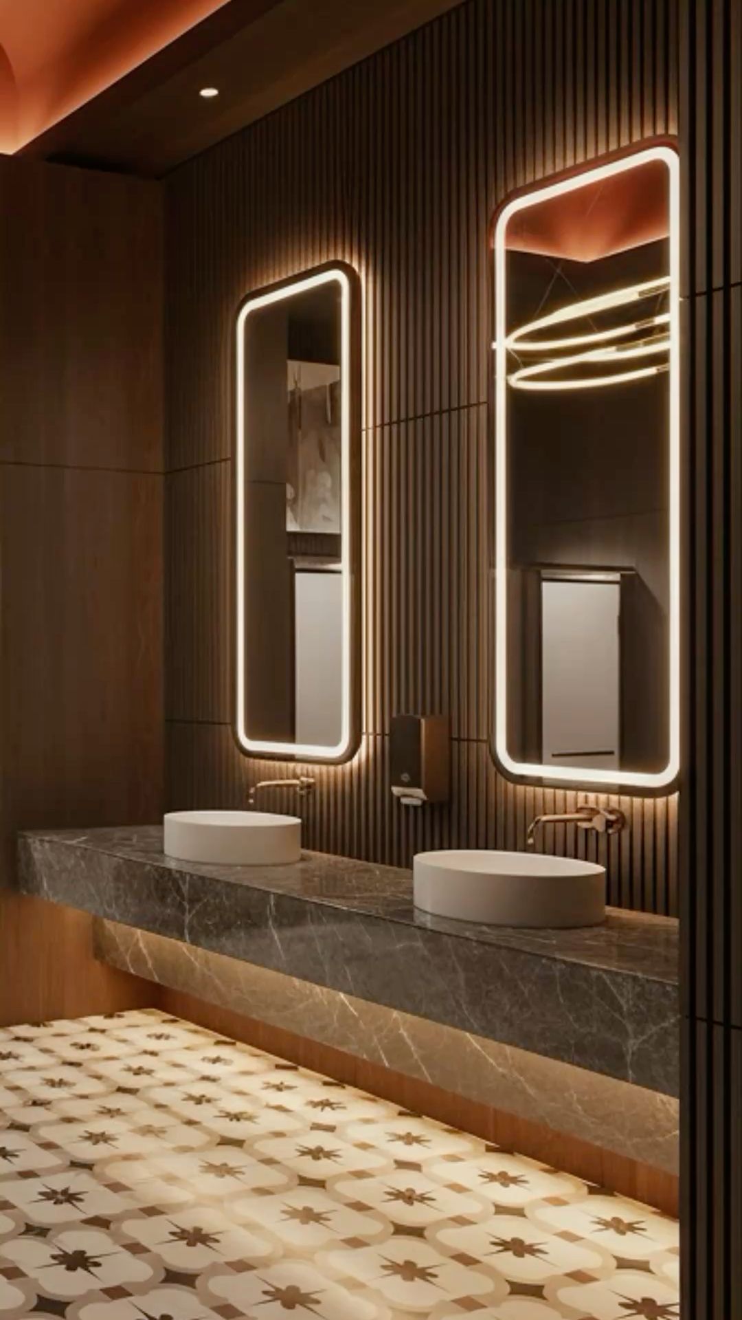 Bronze framed mirror cabinets in a commercial washroom