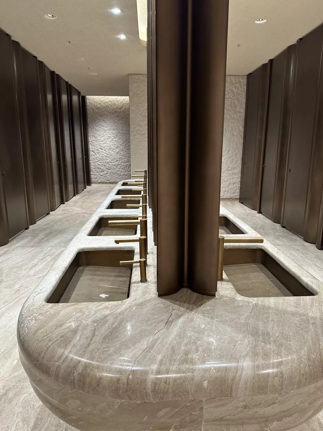 Commercial washroom counter with tall mirror cabinet panels